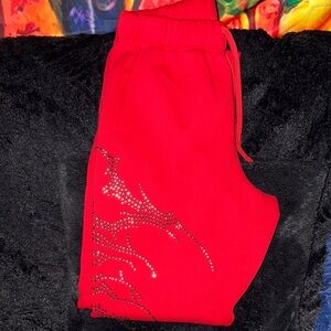 Red Civil Regime sweatpants with rhinestone design